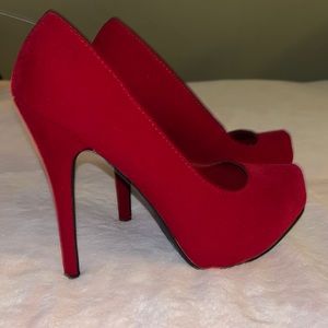 Red suede pumps